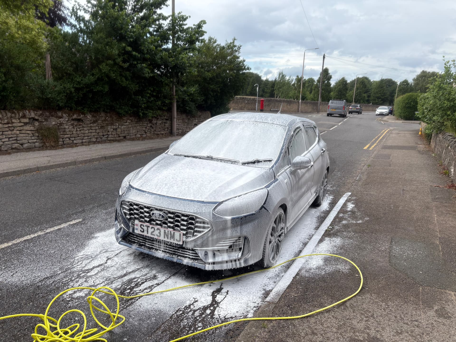 Snow foam wash being applied to a car by Site Clean