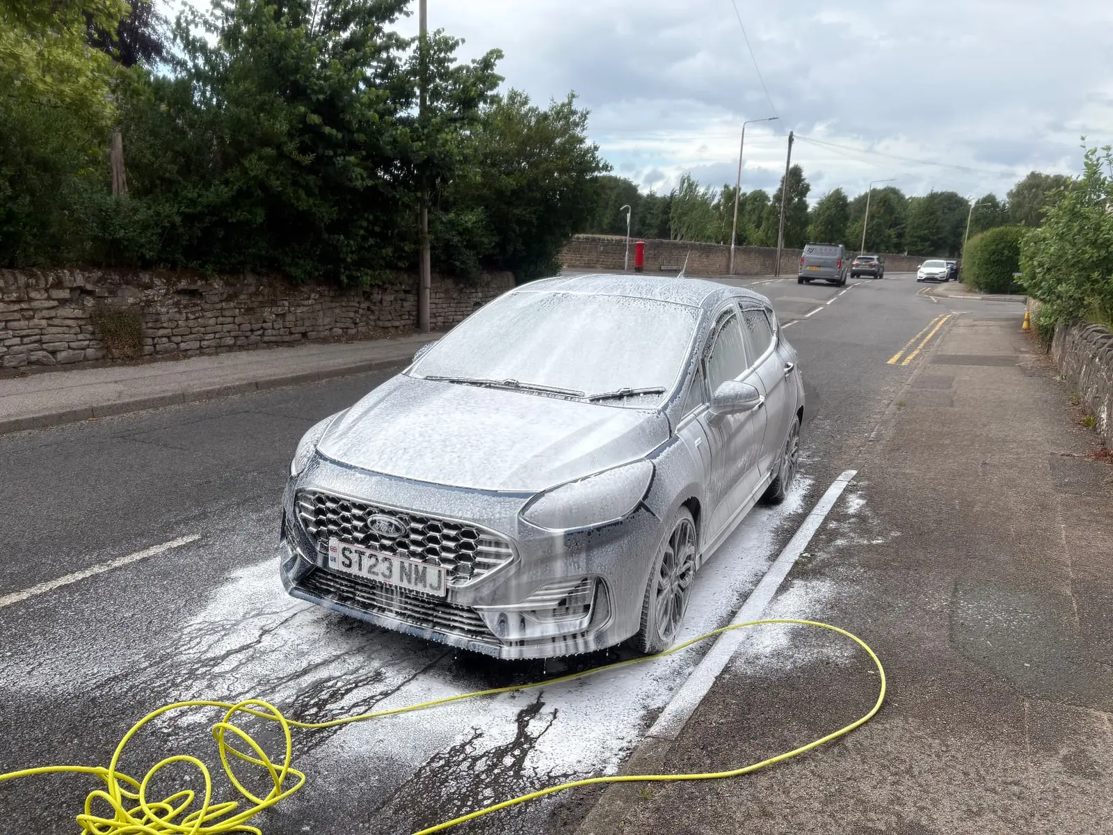 Snow foam wash being applied to a car by Site Clean