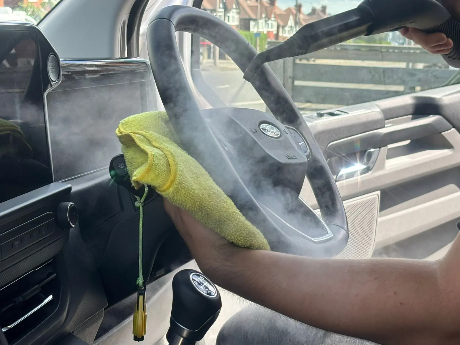Steam cleaning a vehicle interior