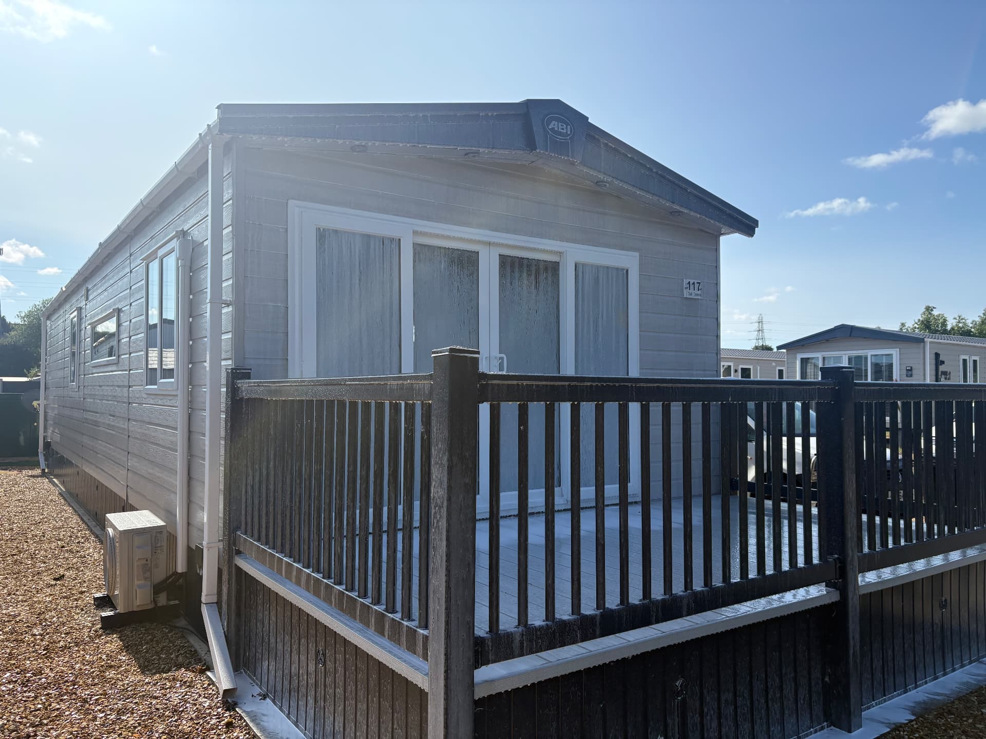 Static caravan and decking covered in cleaning foam