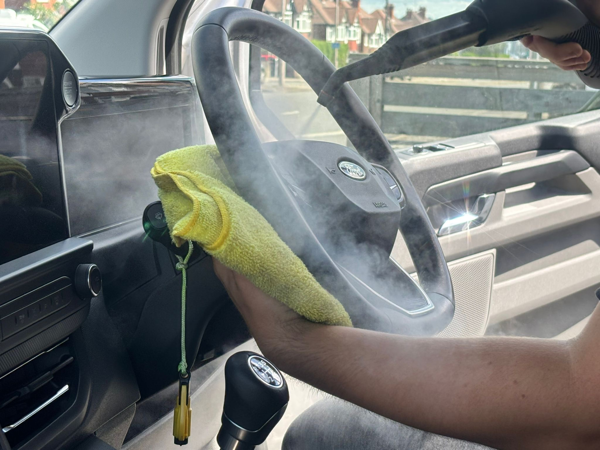 Steam cleaning a vehicle interior